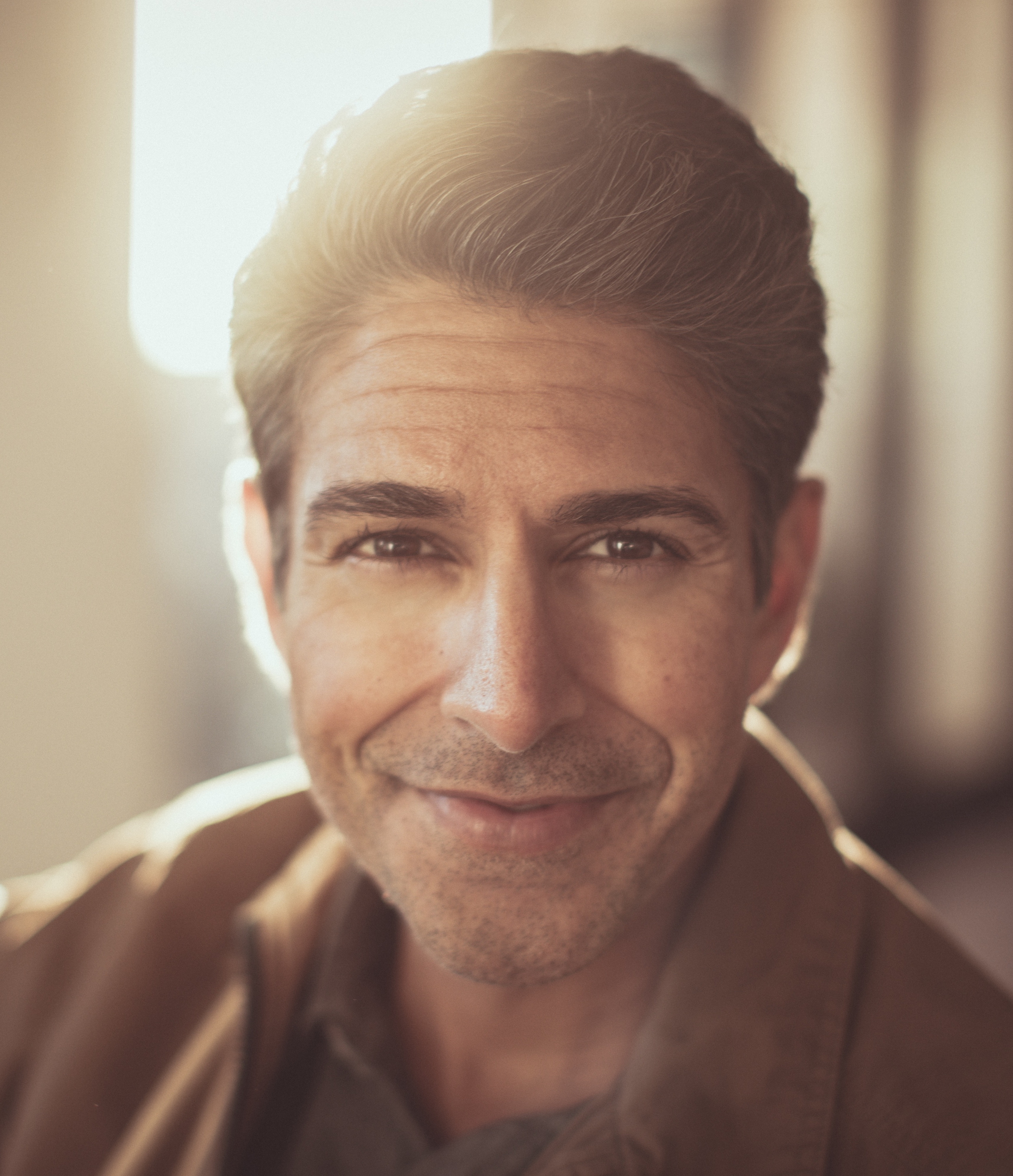 A man in a brown jacket.