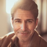 A man in a brown jacket.