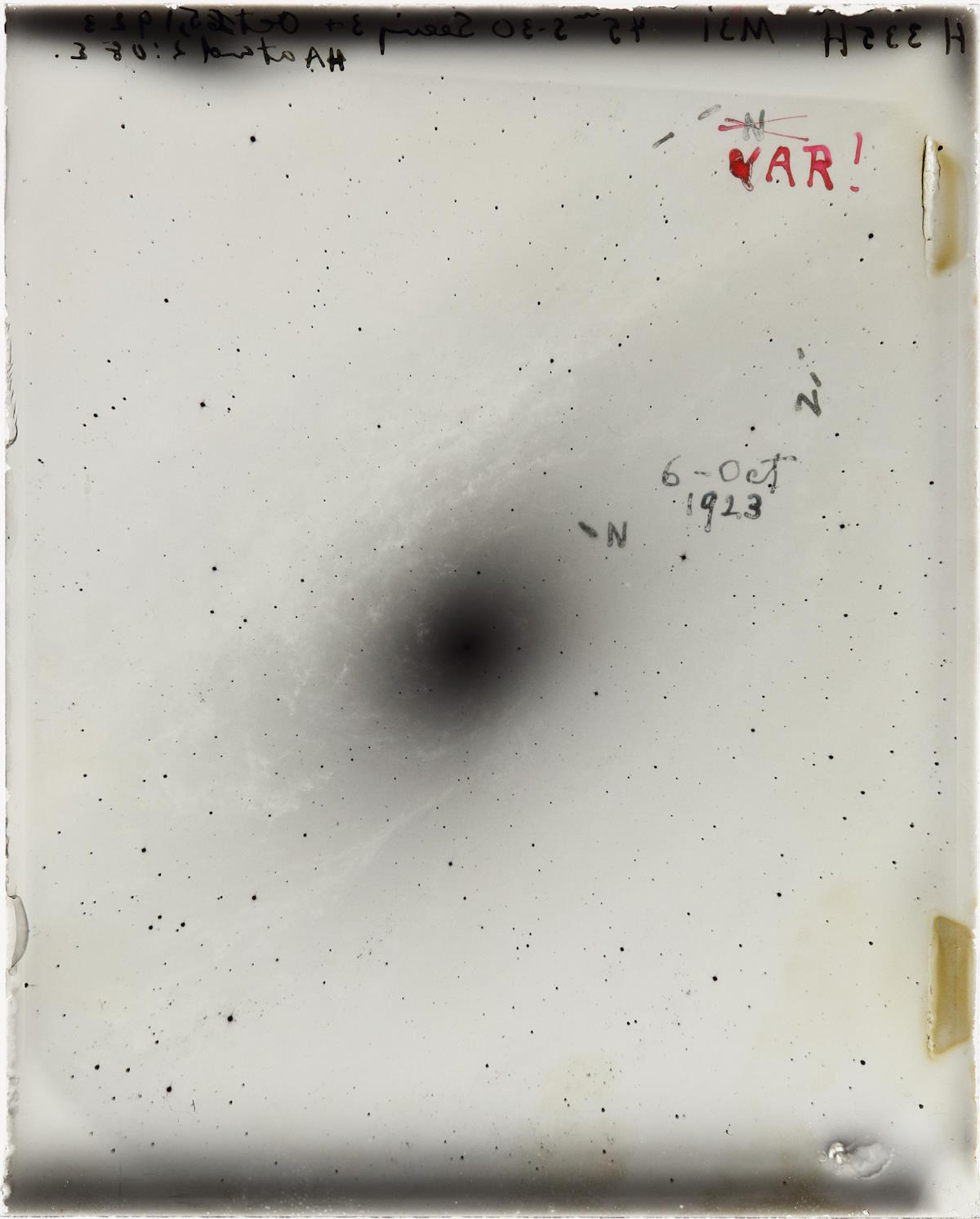 A photograph of a black hole revealing the mysteries of the expanding universe after 100 years.