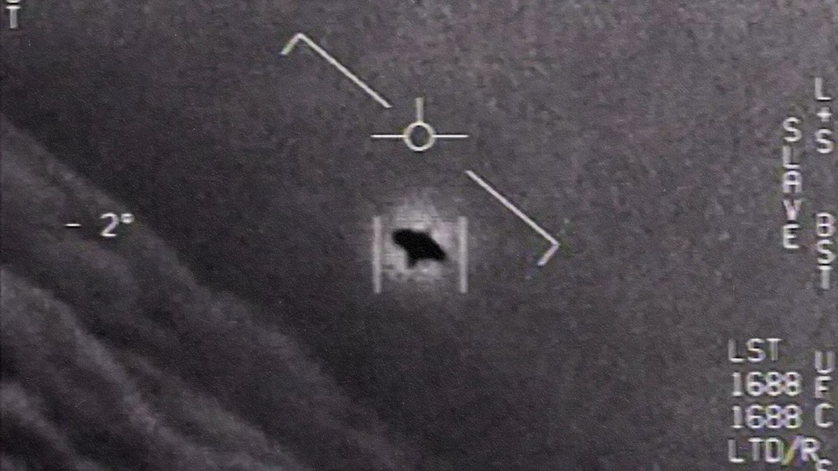 An image of a plane flying in the sky during a congress.