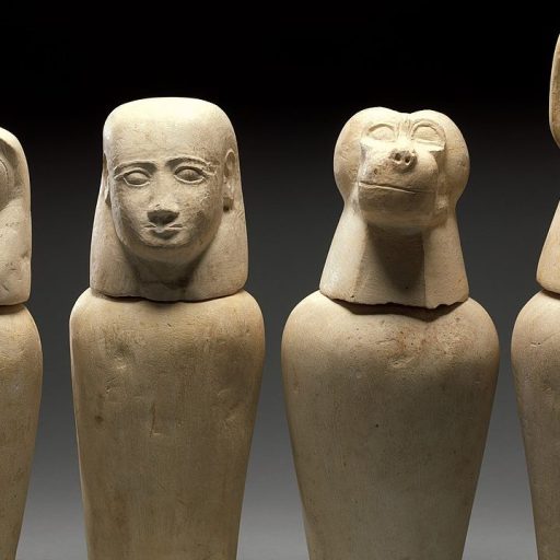 Four egyptian sarcophagi with animal heads emitting the smell of ancient Egyptian mummies.