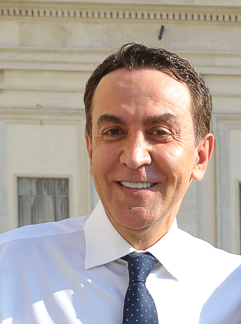 A man wearing a white shirt.