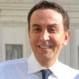 A man wearing a white shirt.