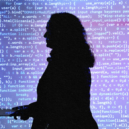 A silhouette of a woman standing in front of a computer screen, showcasing generative AI technology for business.