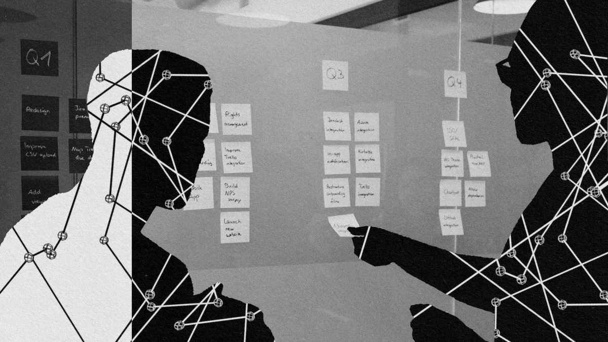 A group of people practicing agile innovation while looking at a wall.