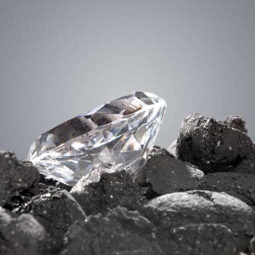 A diamond sits on top of a pile of rocks.