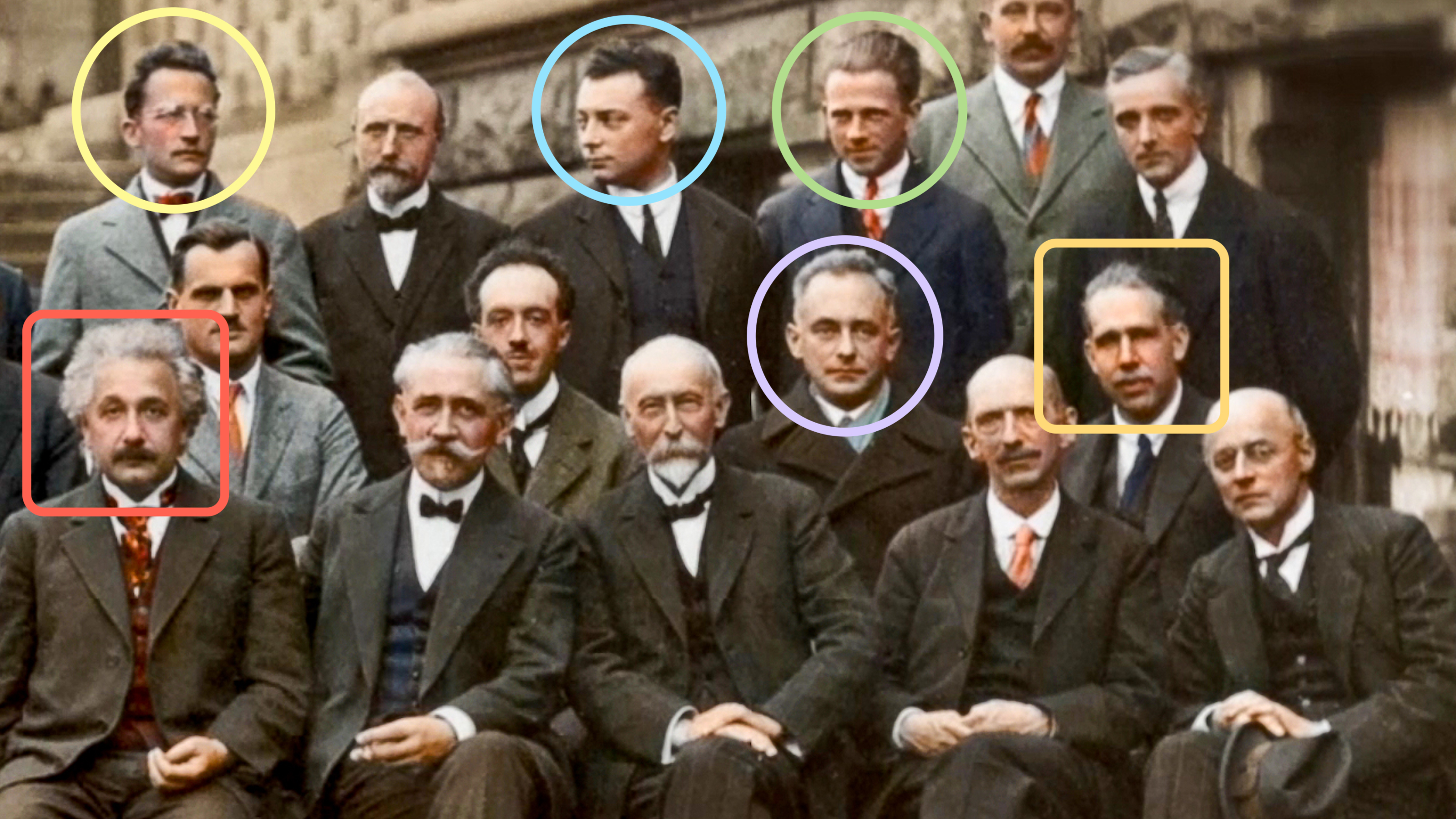 A photo of a group of men with different colored circles on their heads.