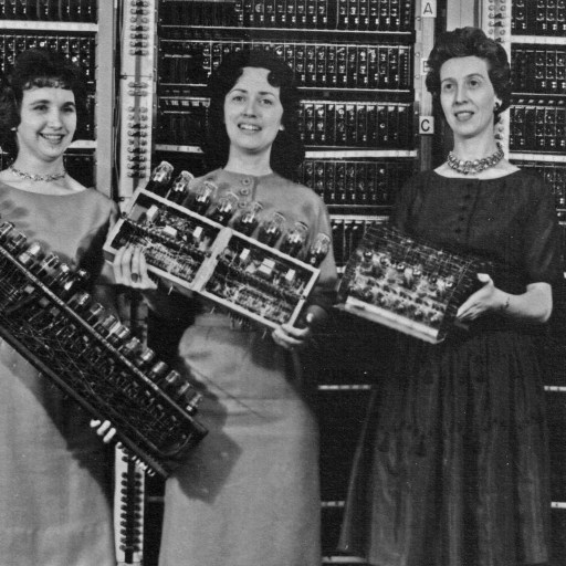 A group of women adopting new technologies.