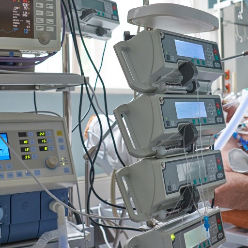 A man is having a near-death experience while laying in a hospital bed.