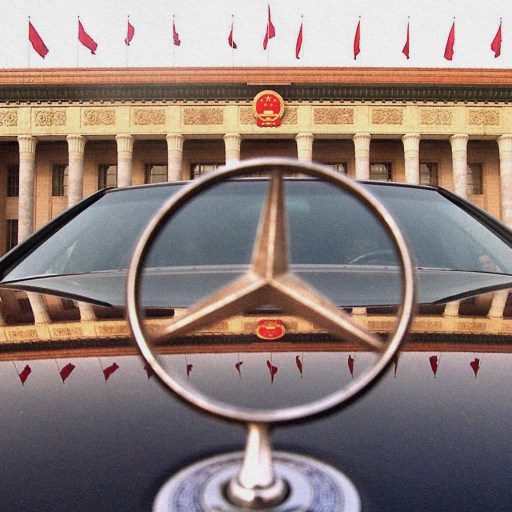 A Mercedes Benz parked in front of a building in Beijing, China.