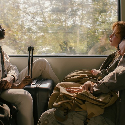 A group of people sleeping on a train.