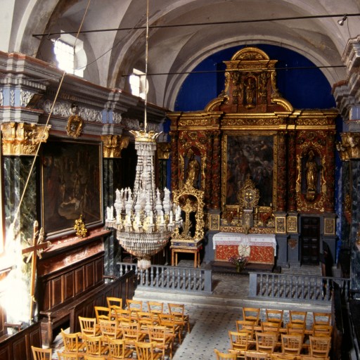 A secularized church with ornate paintings on the walls.