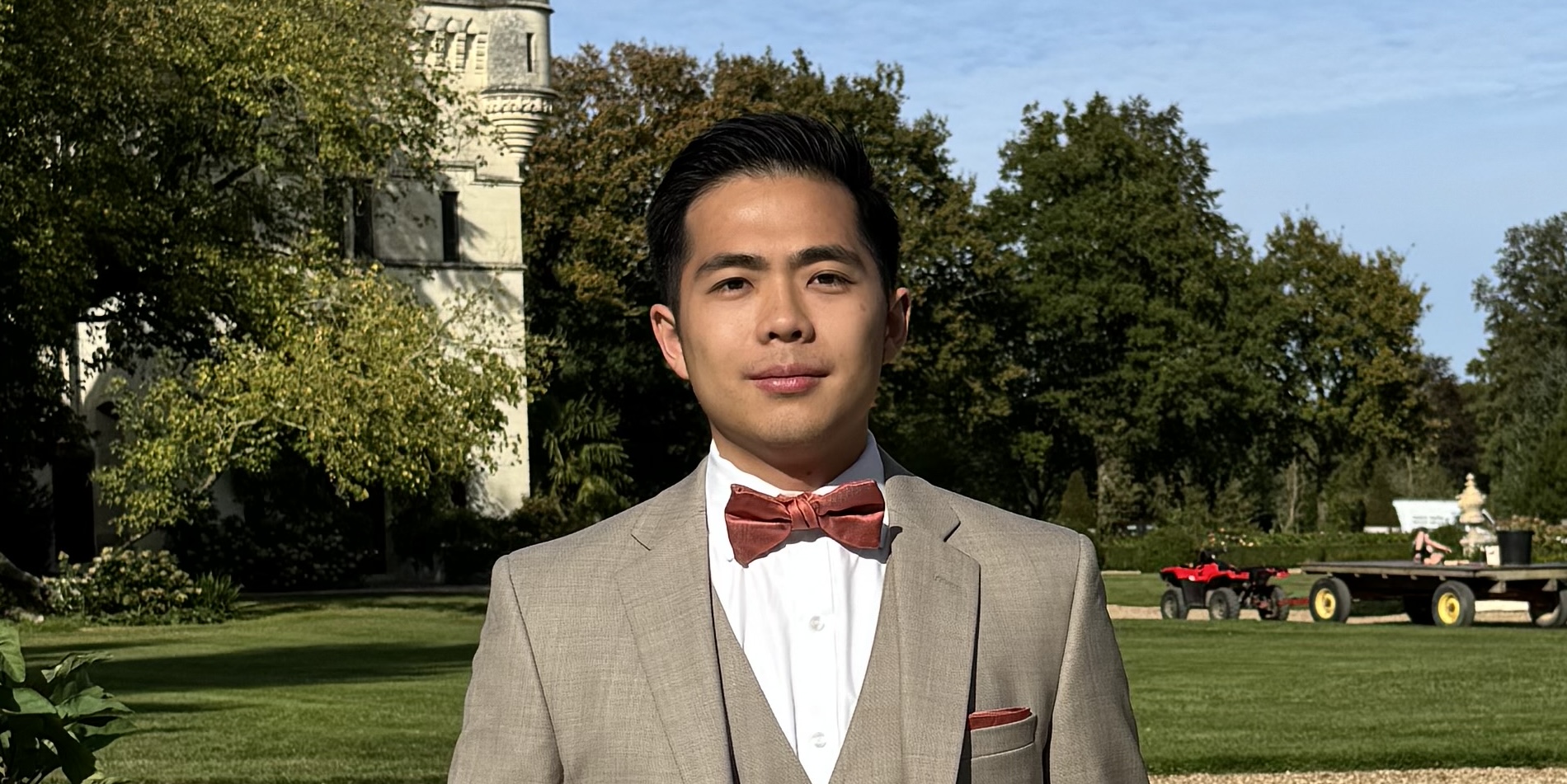 A man in a suit standing in front of a castle, representing an AI startup.