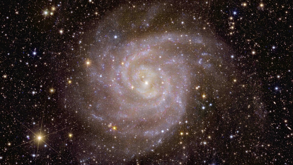 An image of a spiral galaxy in space.