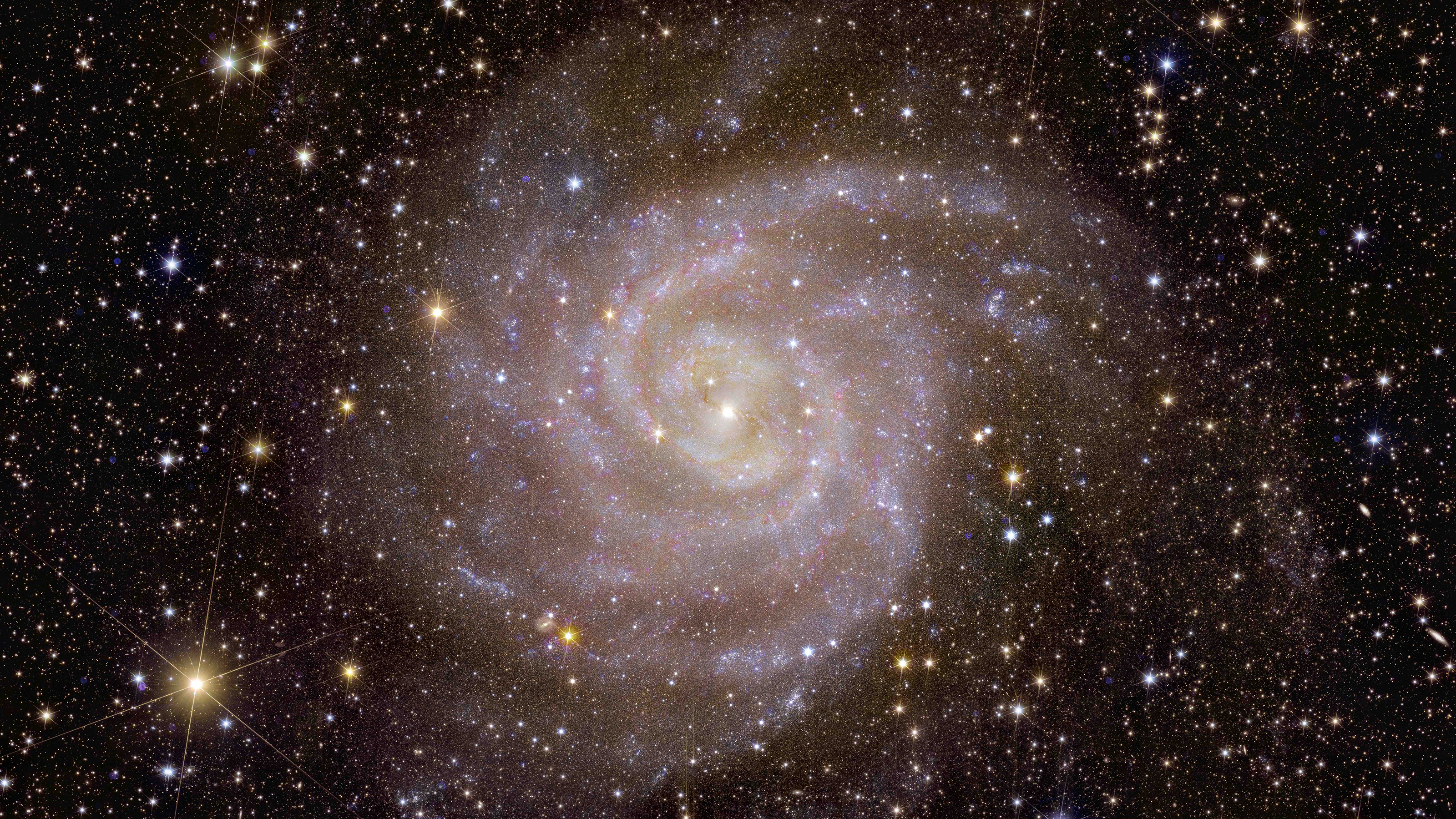 An image of a spiral galaxy in space.