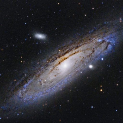 An image of a spiral galaxy in the night sky.