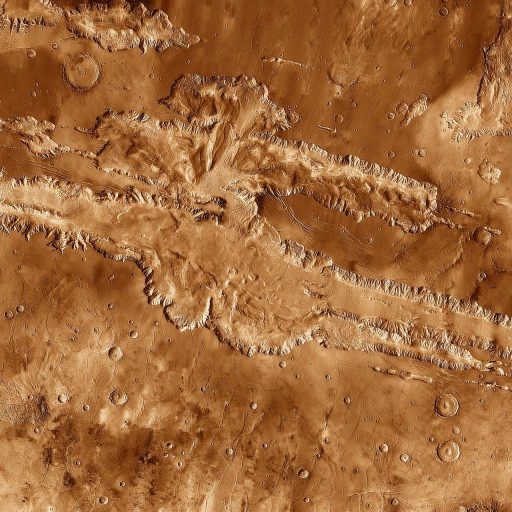 An image of the surface of Mars, showcasing its captivating and unique geological formations resembling a grand canyon.