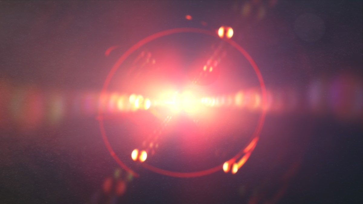 An image of a red light shining on a dark background.