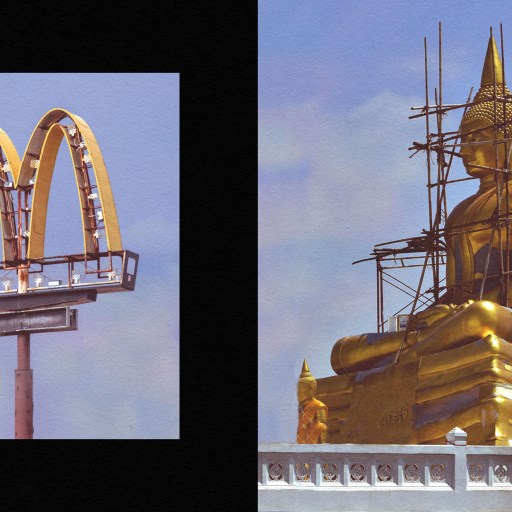 The golden Buddha statue at McDonald's towering beside the iconic McDonald's sign.