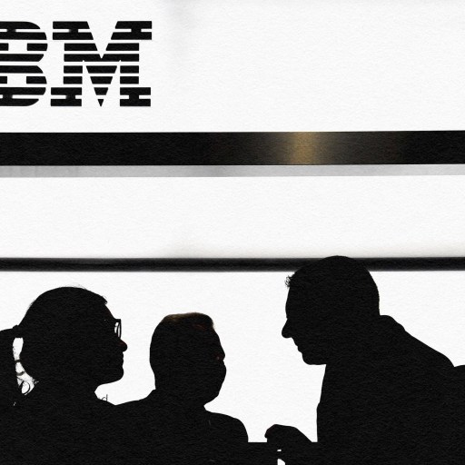 Innovation leaders standing in front of the ibm logo.