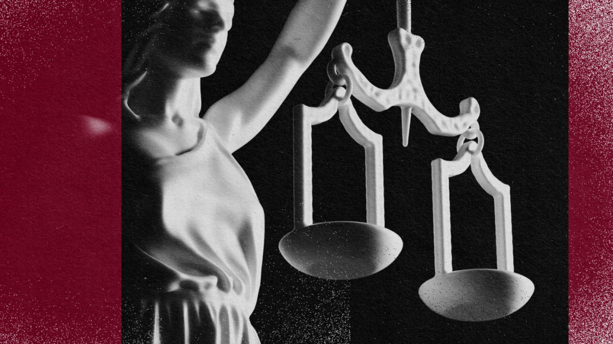 An image of a statue symbolizing human rights, delicately holding scales of justice.