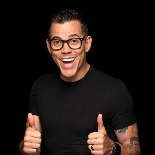 A man with glasses giving a thumbs up.
