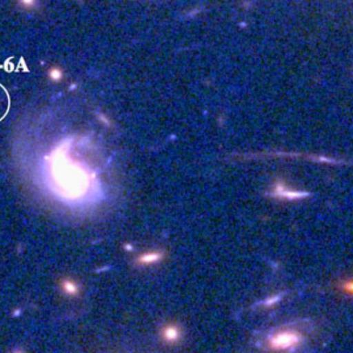 A cluster of galaxies with a star in the middle.