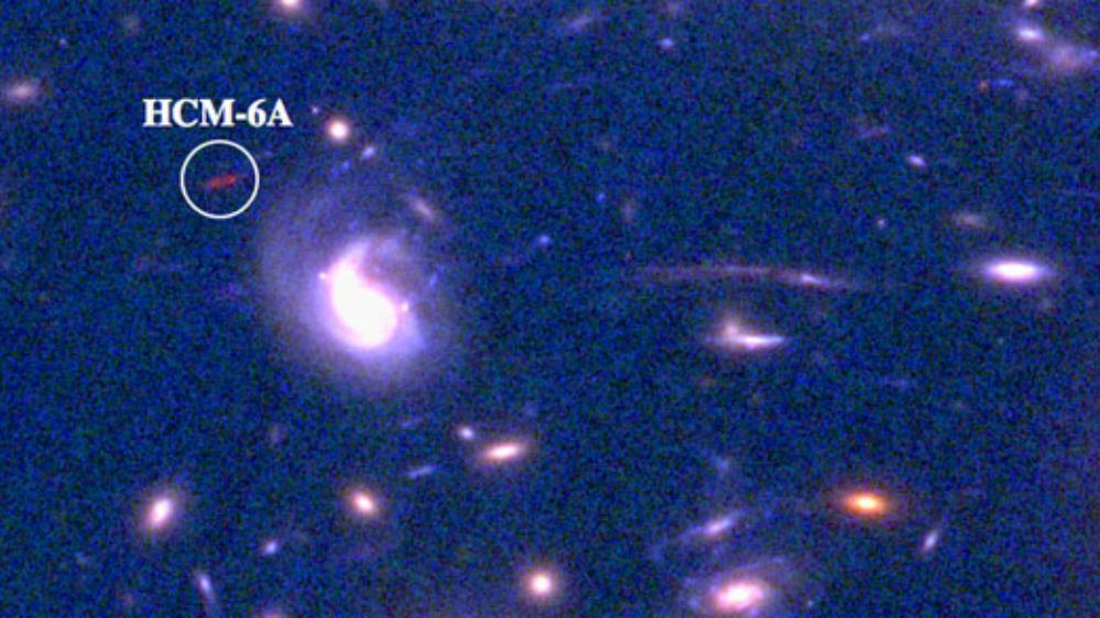 A cluster of galaxies with a star in the middle.