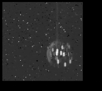 A black and white photo of an object in the sky.