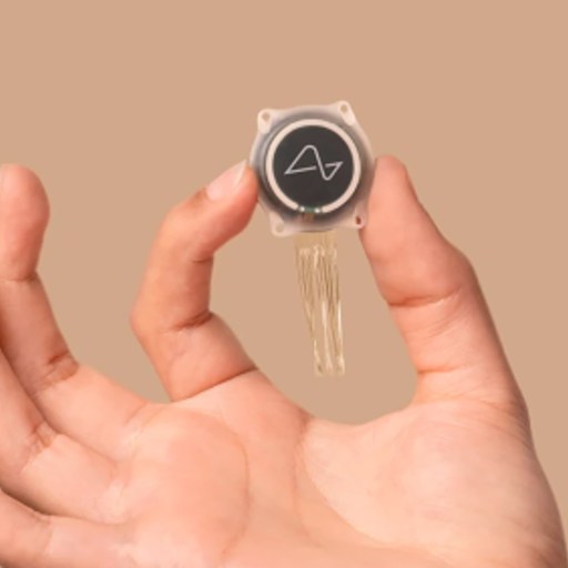 A person holding a small key in their hand.