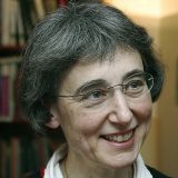 A woman wearing a sweater.