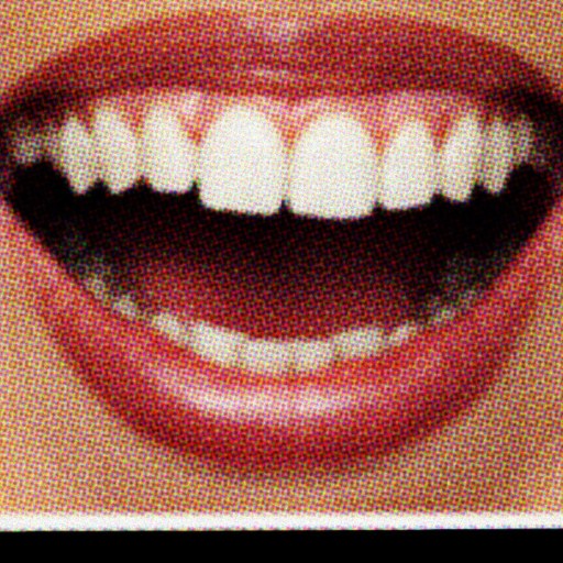 A woman holding up a picture of a smiling mouth.