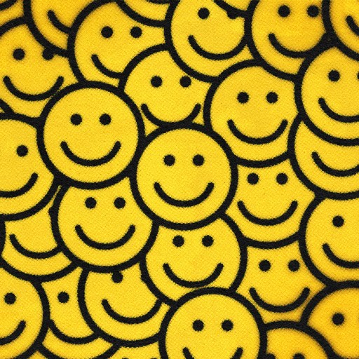A pattern of numerous yellow smiley faces.