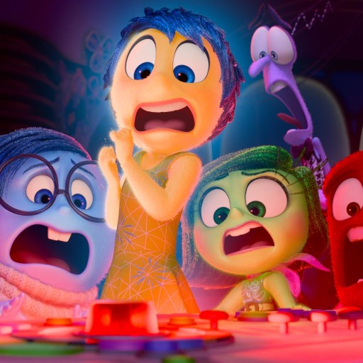Five animated characters with various expressions of alarm gather around a control panel with a red button.