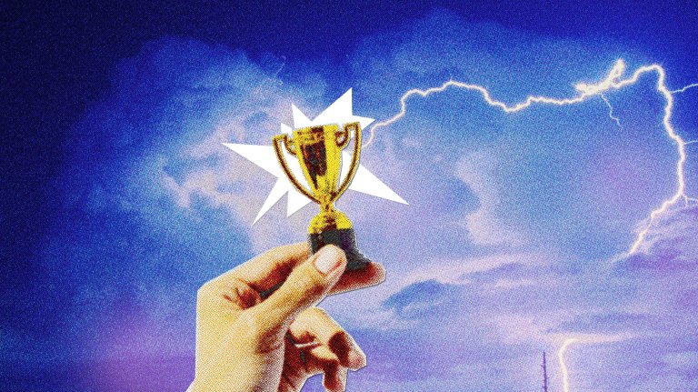 A hand holds up a small gold trophy against a dramatic sky with lightning and a burst of light, symbolizing victory when you lead with love.