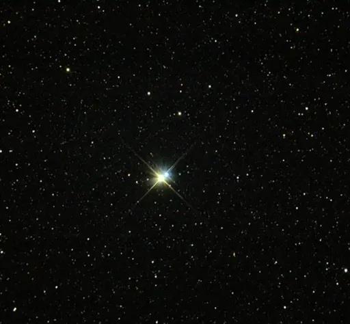 A bright star shining in a dark sky filled with numerous smaller stars. The larger star appears at the center with a noticeable twinkle effect.