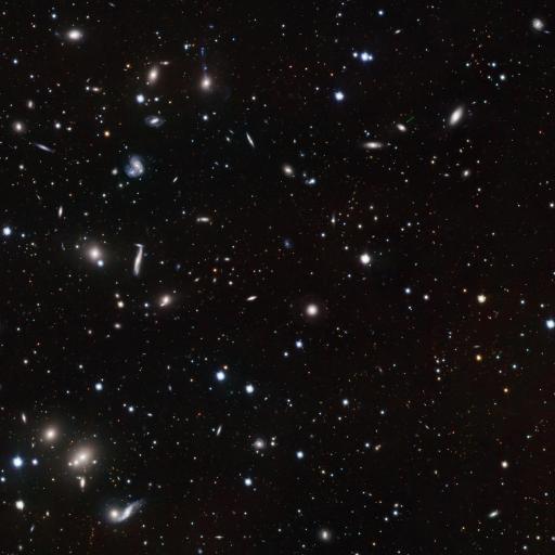 A vast expanse of outer space densely populated with numerous stars, including the typical star, and celestial objects of varying brightness against a dark background.