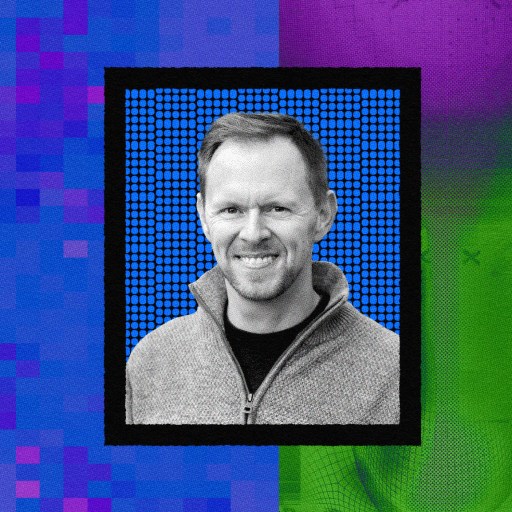 A black and white portrait of a smiling man in a gray sweater is centered against a vibrant, abstract digital background with blue, purple, and green sections, evoking the essence of humanity striking back.