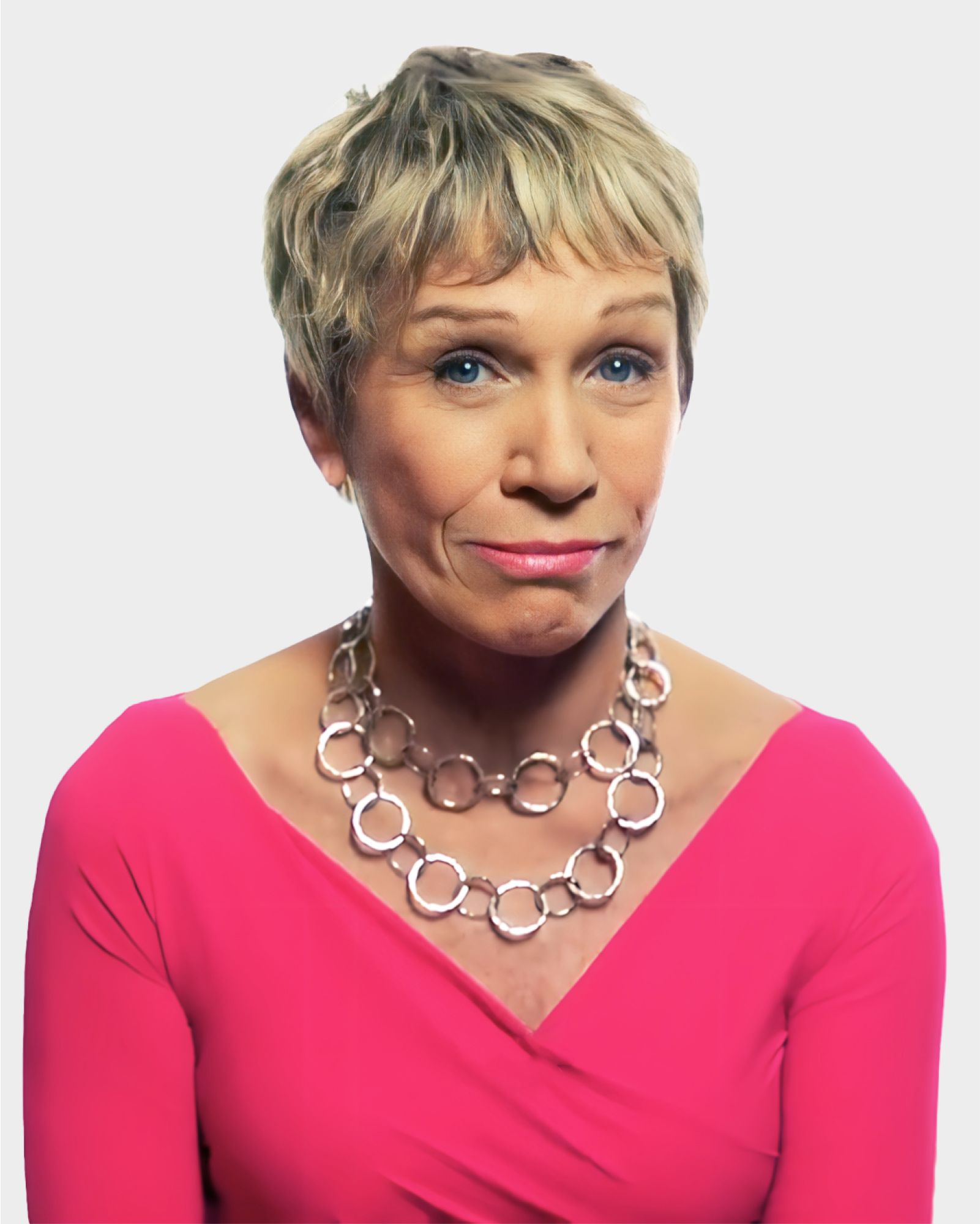 Person with short blonde hair wearing a pink top and large chain necklace, looking directly at the camera against a plain background.