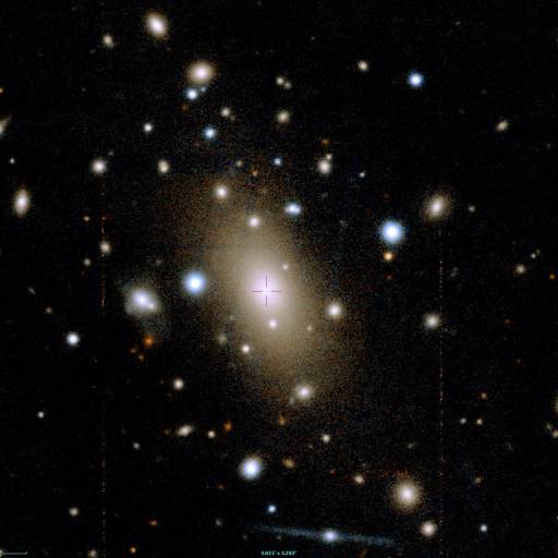 A sky full of stars with a large central galaxy, surrounded by smaller galaxies and bright spots on a dark background.