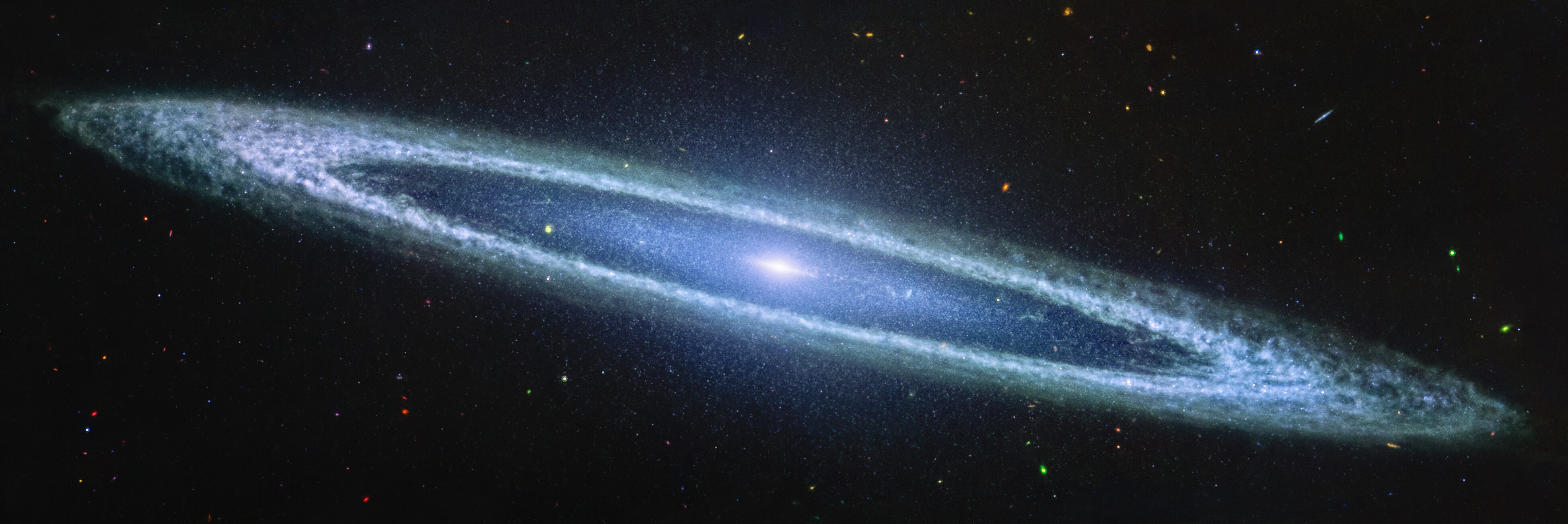 An image of the vibrant Sombrero Galaxy, captured by JWST, showcases a luminous core and expansive spiral arms set against a backdrop of countless distant stars and galaxies.