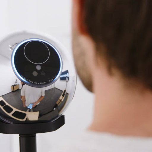 A man looking at a mirror.