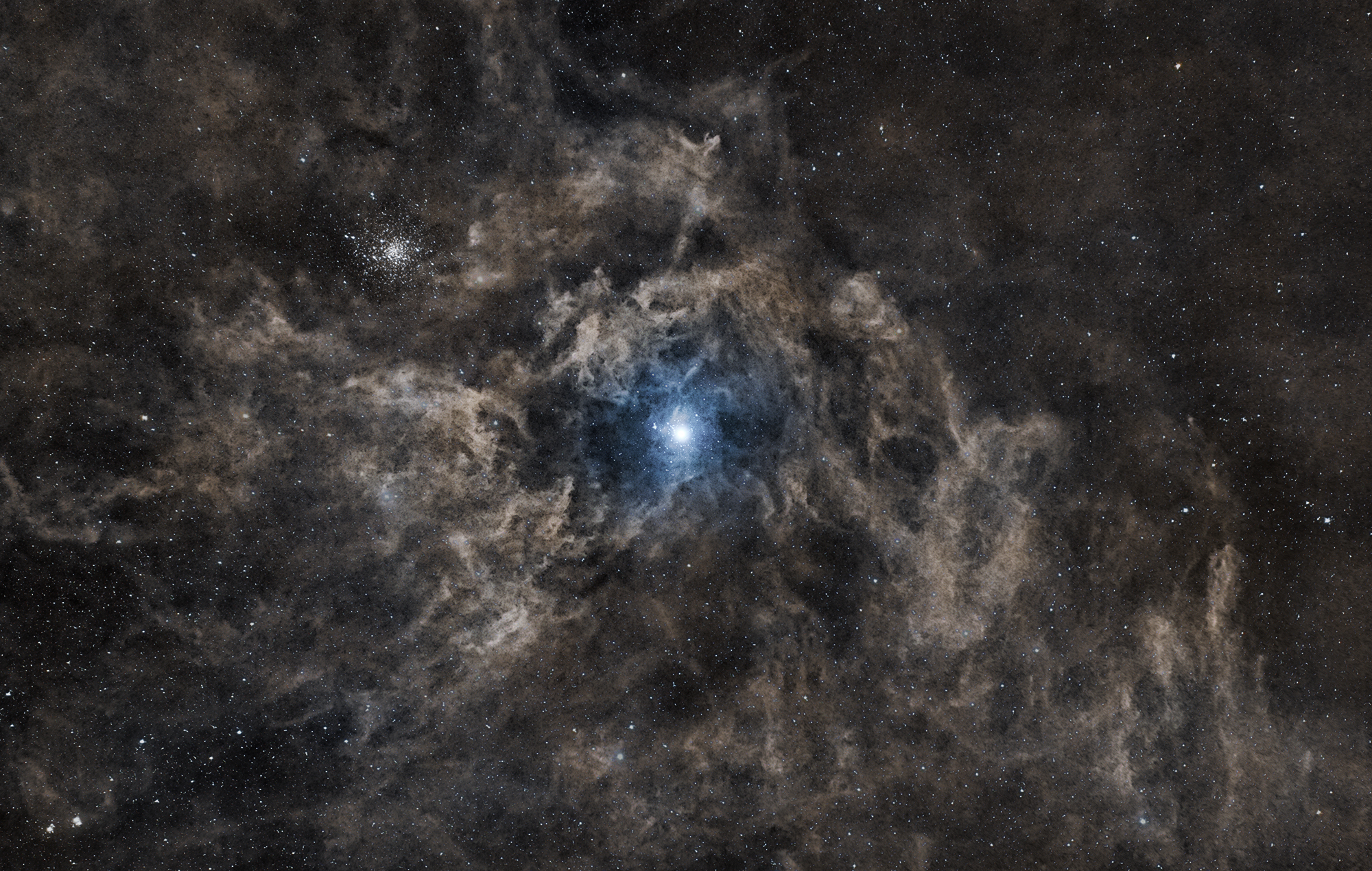 A starry sky unfolds with a bright blue star at its center, encompassed by wispy clouds of interstellar dust reminiscent of types nebula, along with numerous small stars scattered across the dark backdrop.