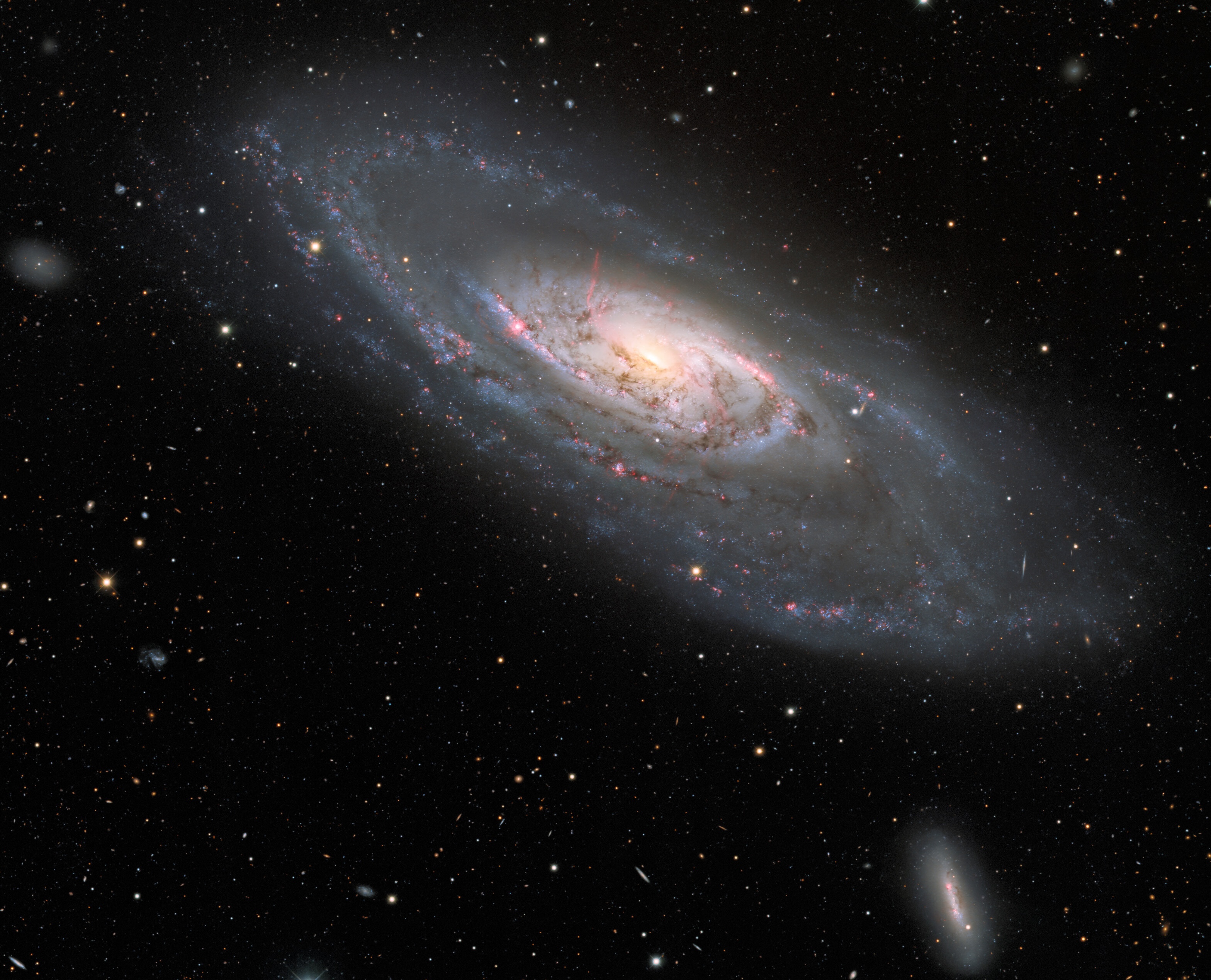 A captivating edge galaxy tipped towards us, against a starry expanse, reveals its radiant core and swirling spiral arms.