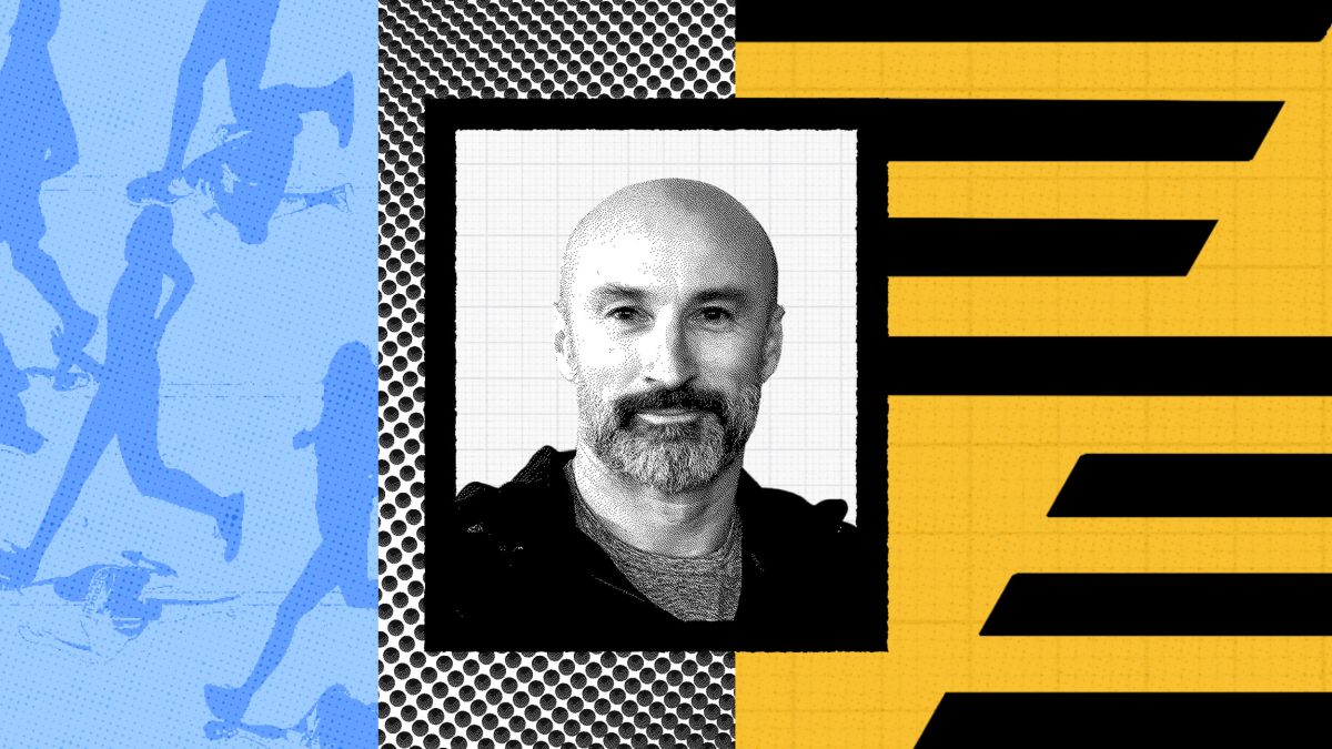A black and white photo of a bald man with a beard, reminiscent of a Christian Toetzke interview, is centered against a colorful abstract background featuring blue, yellow, and black geometric patterns.