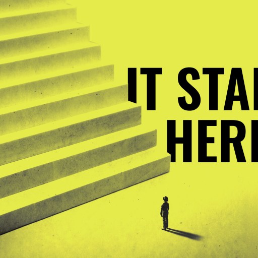 A small person stands at the base of a large staircase with the words "IT STARTS HERE" in bold black letters on a yellow background.