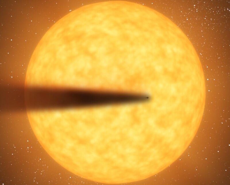 A glowing orange planet casts a shadow in space amid a backdrop of stars.