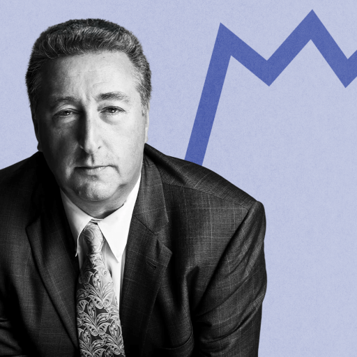 Barry Ritholtz, a man in a suit and tie, stands confidently before a blue zigzag line on a light backdrop.