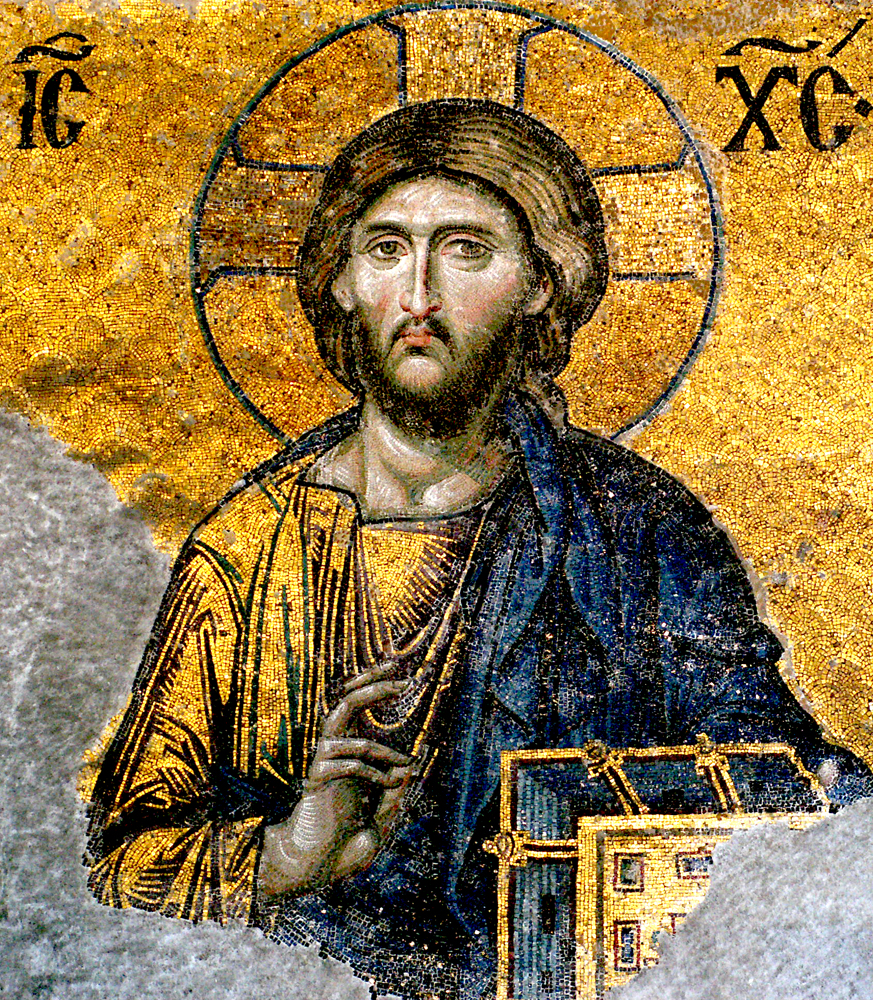 Mosaic of Jesus Christ with a golden halo, giving a blessing gesture, set against a gold background; part of the image is worn away at the lower left.