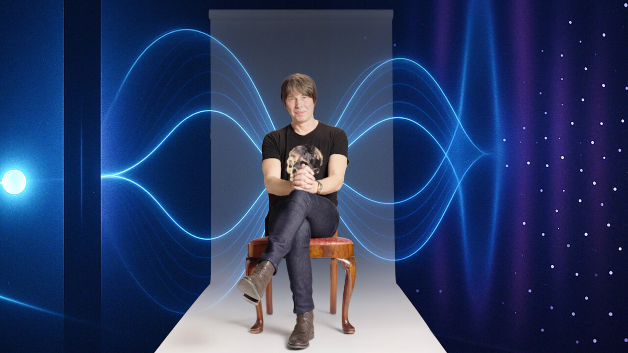 A person sits on a chair with hands clasped, facing forward. Blue waveforms and dots form a digital backdrop behind them.